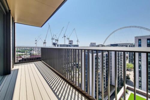 a balcony with a view of the city at Repton Gardens at Wembley Park in London