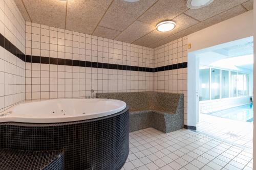 Koupelna v ubytování Langeland luksuslejlighed med pool og spa