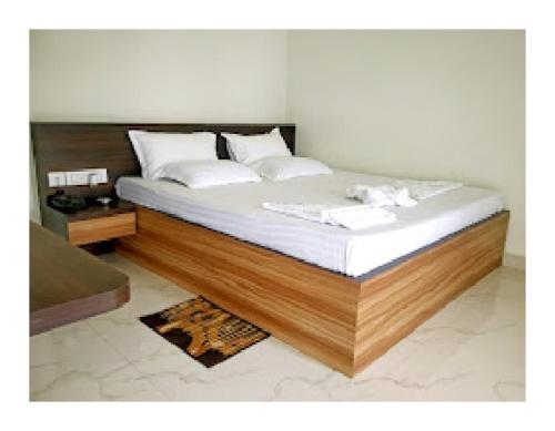 Postel nebo postele na pokoji v ubytování Bongobari Mandarmani