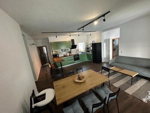 a living room with a table and chairs and a couch at Villa Aura in Orebić