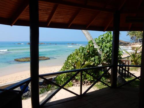 a view from the porch of the beach at Unawatuna Beach House in Unawatuna
