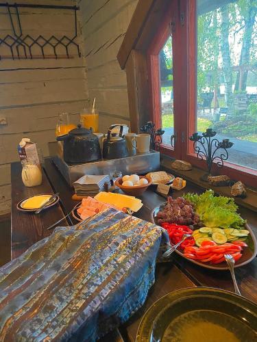 a table with a buffet of food on it at Laawu Kultainkoski in Kotka