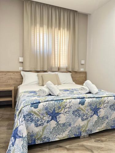 Postel nebo postele na pokoji v ubytování B&B Giglio di mare