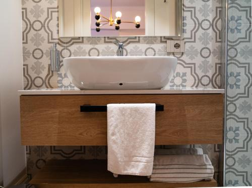 a bathroom with a white sink and a mirror at Albergo Bianchi Stazione in Mantova