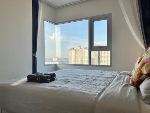 Voodi või voodid majutusasutuse Ramkhamhaeng Condo toas