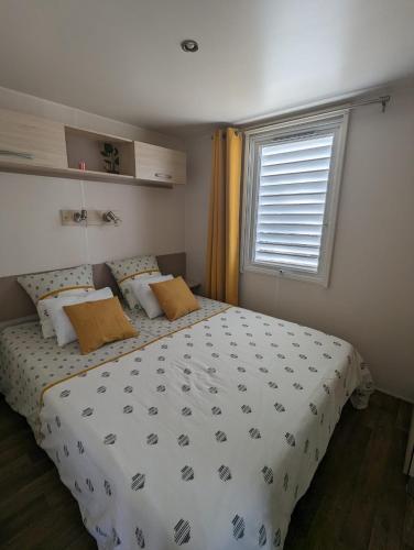 a bedroom with a large bed and a window at Piana in Lumio