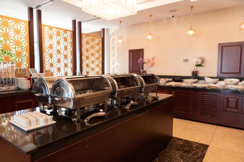 a kitchen with a coffee machine on a counter at Tilya Resort Hotel in Trabzon