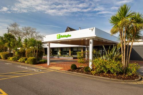 a gas station on the side of a road at Holiday Inn Reading South M4 Jct 11 by IHG in Reading
