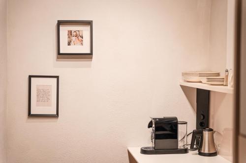 a kitchen with a coffee maker on a counter at H5 Grauer Bär Studios & More in Innsbruck