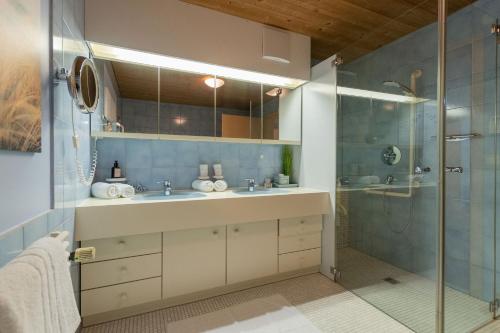 a bathroom with a sink and a shower at Haus Helena in Mellau