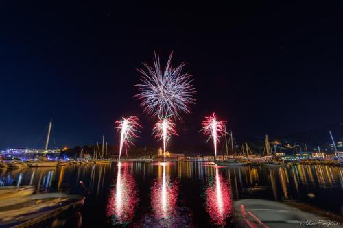 a firework display in the water at night at Il Profumo Dellegrazie in Le Grazie