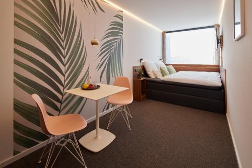 Katil atau katil-katil dalam bilik di TIN INN l Hückelhoven einfach gut - Das Hotel aus hochwertig ausgebauten Überseecontainern