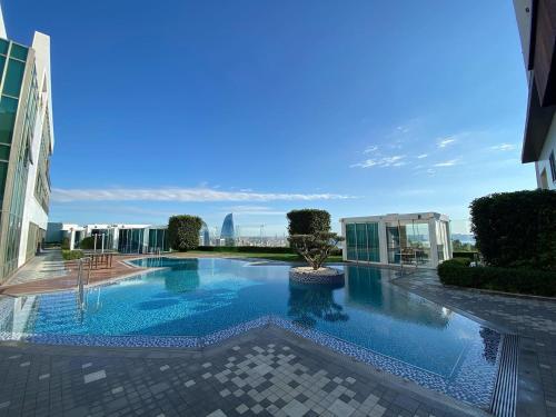 a large swimming pool in the middle of a building at Badam d'Art Boutique Hotel in Baku