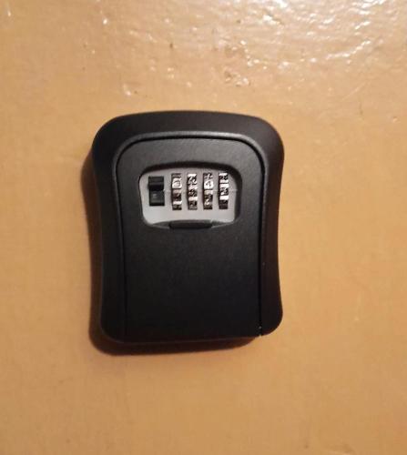 a black remote control attached to a wall at Двухкомнатная квартира Smart-Home in Daugavpils