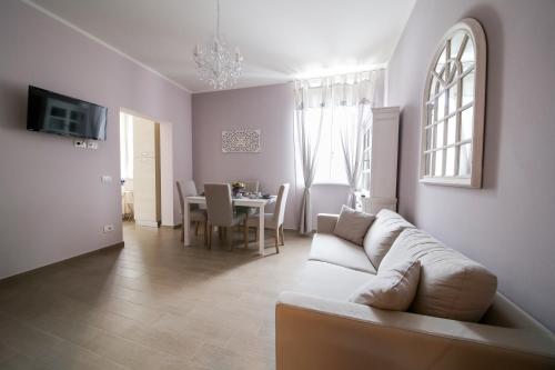 a living room with a couch and a table at La Vecchia Tenenza B&B in Città della Pieve