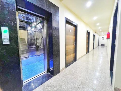 a hallway of a building with a swimming pool at Hotel Panchsheel inn in Ajmer