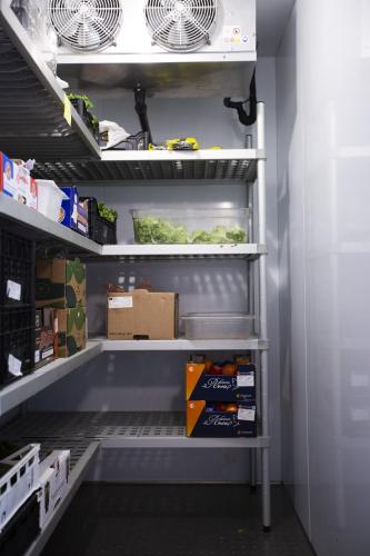 a walk in pantry with an empty refrigerator at Hotel Nevada in Tarvisio