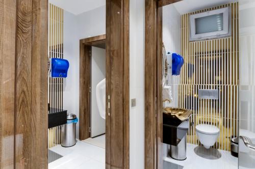 a bathroom with a sink and a toilet at PARK YALÇIN HOTEL in Mersin