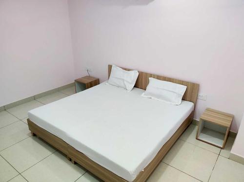 Postel nebo postele na pokoji v ubytování OYO Hotel Palazzo