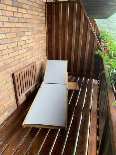 a white refrigerator sitting on a wooden deck at Apartmán Žalý in Benecko