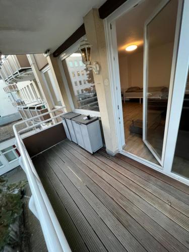 an empty balcony of a house with a room with sliding glass doors at Unterkunft NRW ID1 in Leverkusen