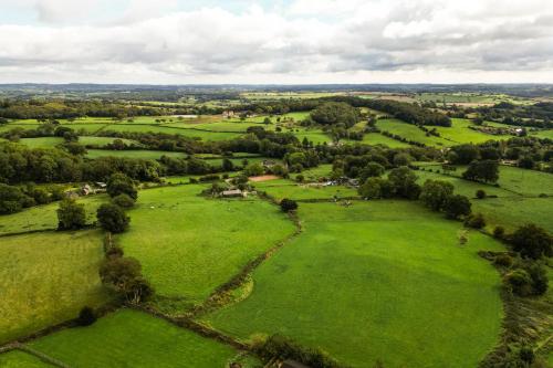 an aerial view of a field of green grass at Stag Manor Hot Tub Retreat near Peak District in Crich