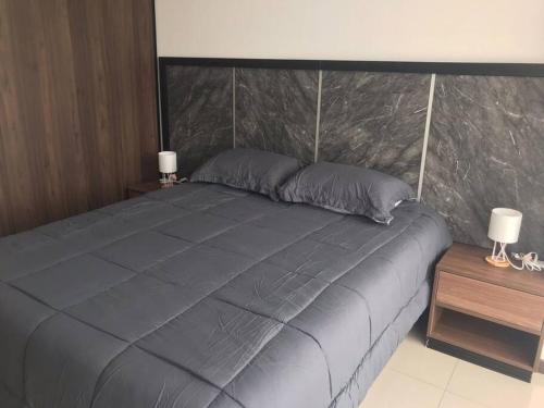 A bed or beds in a room at Dpto de 2 Hab, zona Equipetrol. Amá Santa Cruz!
