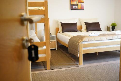 a bedroom with two bunk beds and a ladder at Apartman - Sobe Tiha Luka, Bjelašnica in Bjelašnica