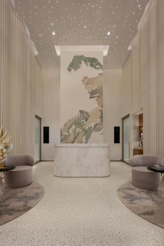 a rendering of a lobby with a table and chairs at SO/ Uptown Dubai in Dubai