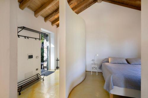 a bedroom with a bed and a window at Il Mulino - Appartamento Terra in Borzonasca