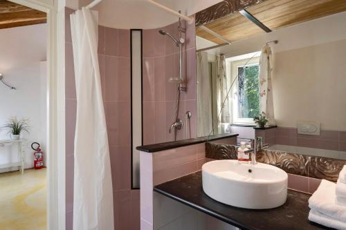 a bathroom with a sink and a shower at Il Mulino - Appartamento Terra in Borzonasca