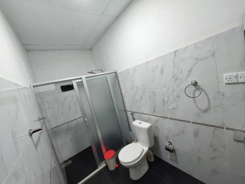 a bathroom with a shower and a toilet at HOSTEL KATUNAYAKE At COLOMBO AIRPORT TRANSIT in Katunayake