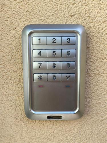 a cell phone is attached to a wall at Villa Jasmine in Bolzano