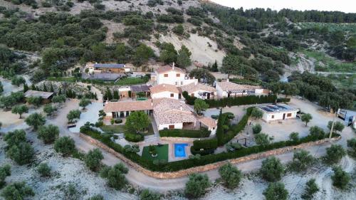 an aerial view of a house on a hill at ENTRESIERRAS Apartamentos rurales con chimenea, barbacoa y espacio para eventos in Cazorla