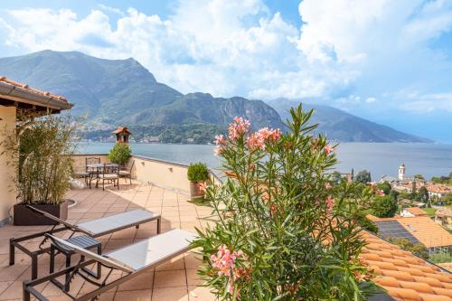 a patio with a view of the water and mountains at Villa La Perla - Bellagio in Bellagio