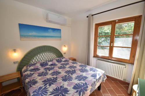 Lova arba lovos apgyvendinimo įstaigoje Appartamenti Mimosa - Clima, giardino, posti auto