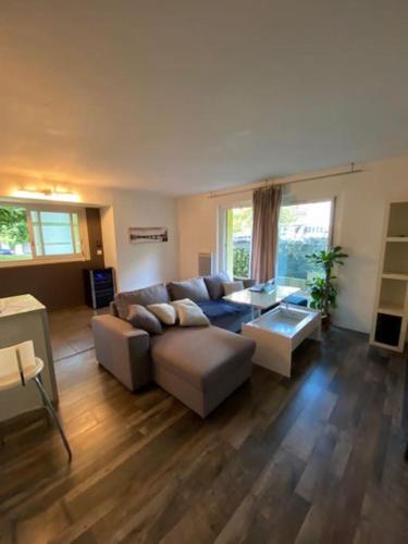 a living room with a couch and a table at Appartement T2 Bayonne-Anglet in Bayonne