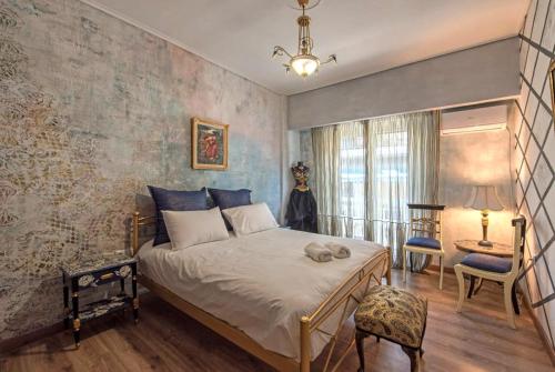 a bedroom with a large bed in a room at Visionery apt in Pagrati in Athens