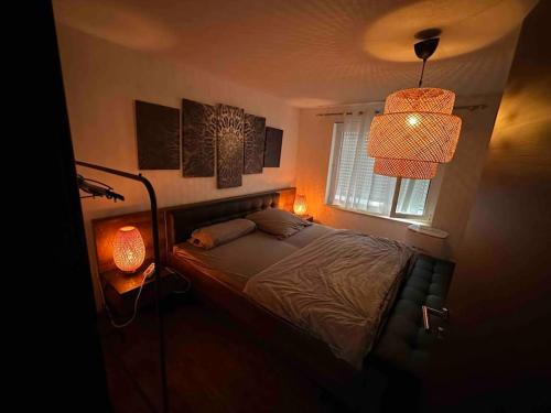 Säng eller sängar i ett rum på Wohnung in Kressbronn am Bodensee