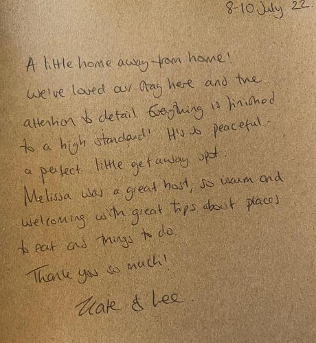 a letter written in black writing on brown paper at The Nest in Sway