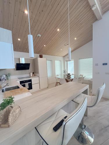 a kitchen with a large wooden table and chairs at Casa Nunki in Guadalix de la Sierra