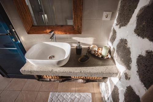 a bathroom with a sink and a mirror at Casa Melián in Playa Blanca