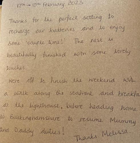 a handwritten letter with handwriting on a piece of paper at The Nest in Sway