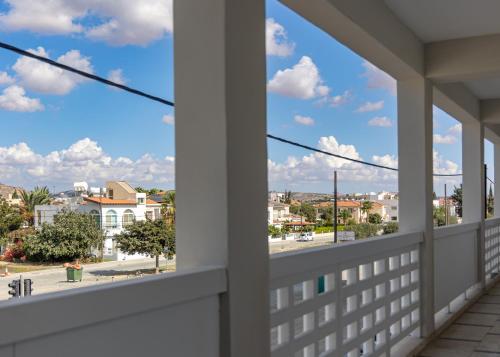 a balcony with a view of a city street at Larnaca BeachHouse in Larnaka