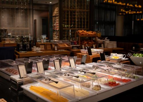 a buffet line with different types of food on display at Hilton Reykjavik Nordica in Reykjavík