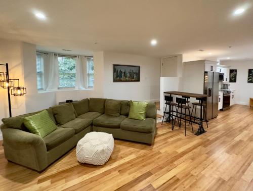a living room with a couch and a table at Perrin Place Unit 1 in Boston