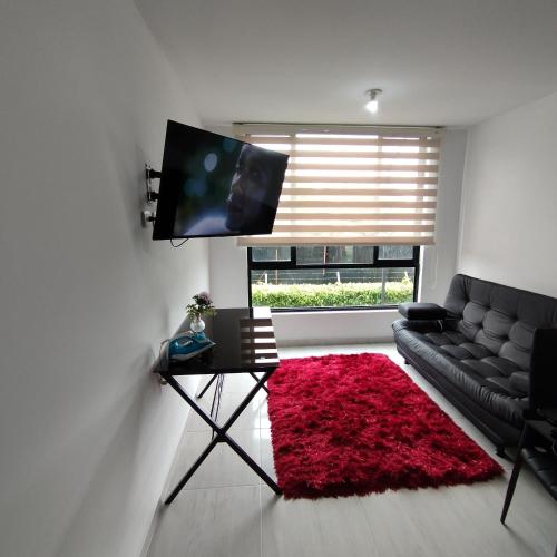Et tv og/eller underholdning på Apartamento cómodo y divertido