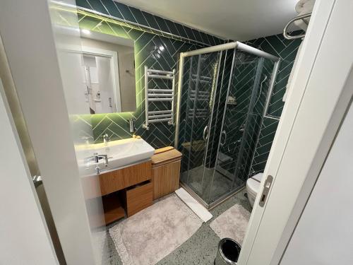 a bathroom with a sink and a shower at Istanbul Apartments in Istanbul