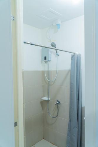 a bathroom with a shower with a shower curtain at Condotel Northpoint 2 Bedroom 1 bathroom in Davao City