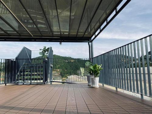 a balcony with a view of a building at Da Quy Harmony Homestay in Da Lat